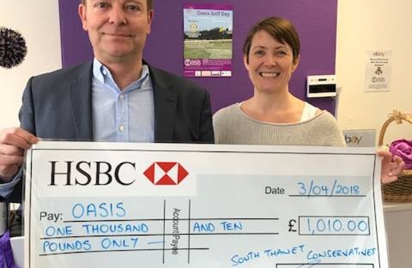 Craig Mackinlay presents cheque to Oasis