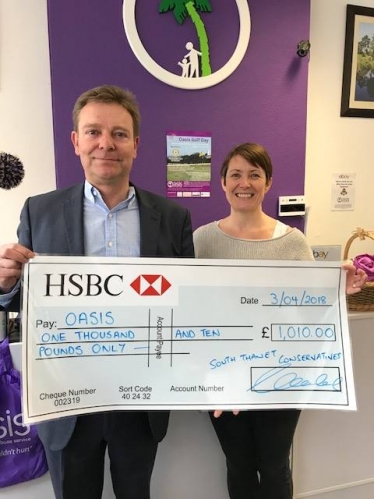 Craig Mackinlay presents cheque to Oasis